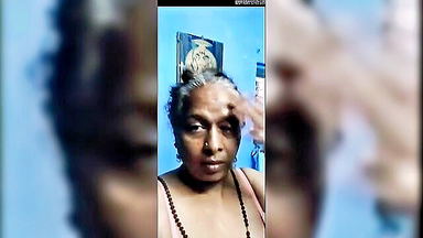 Mature Indian lady topless tease xxx clip